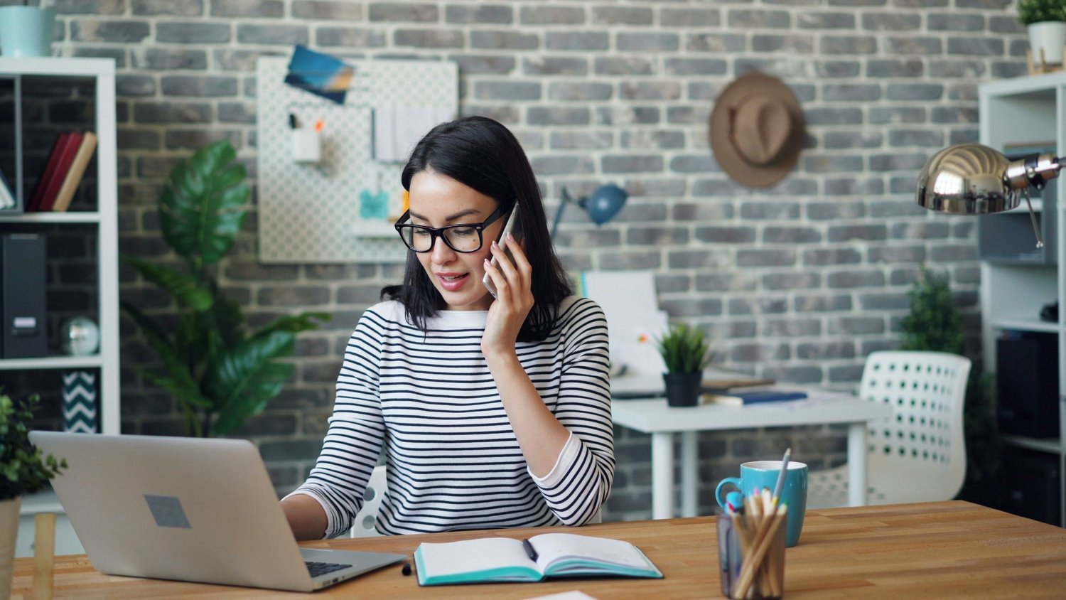 A person planning at a desk at home